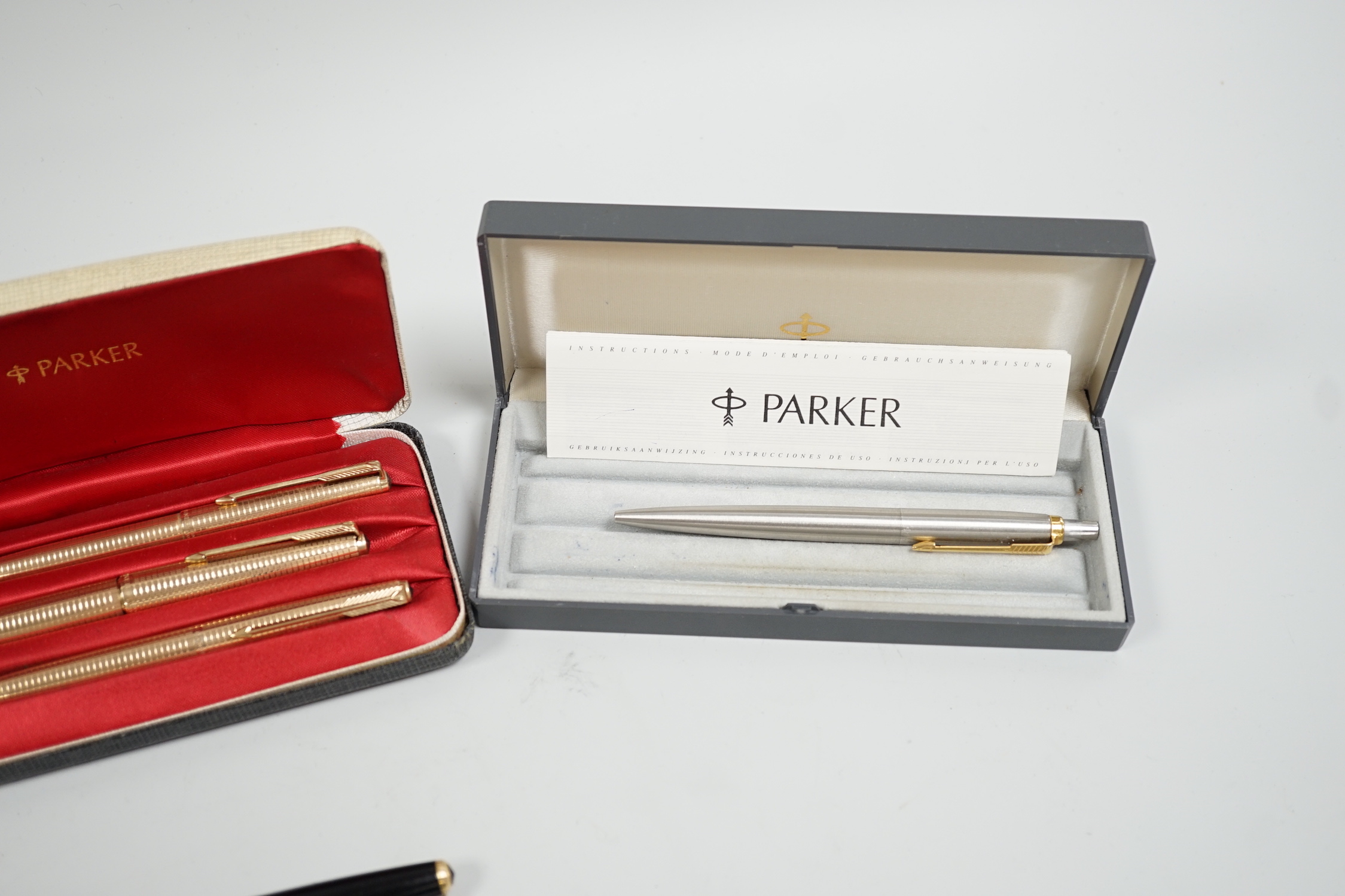 A Parker gold plated pen/pencil biro set and other Parker pens